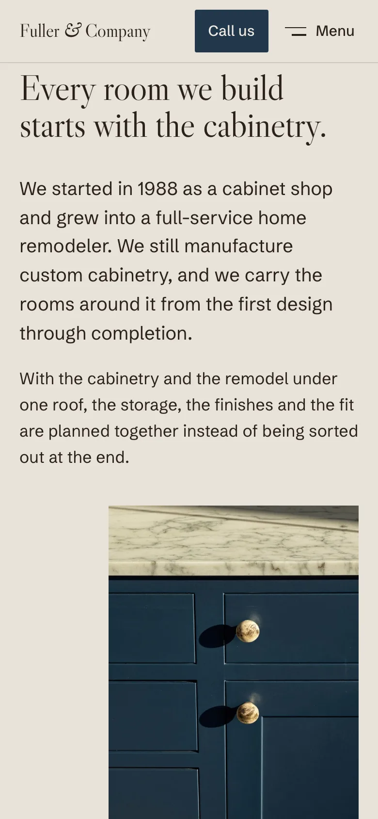 The same section on a phone: a compact top-left logo, readable paragraphs and the blue cabinetry photograph at full width.